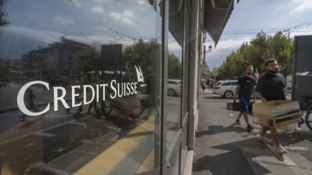 Pedestrians pass a Credit Suisse Group AG bank branch in Geneva, Switzerland, on Monday, July 25, 2022. Credit Suisse report 2Q earnings on July 27.