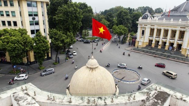 The Vietnamese flag flies atop the Hanoi Stock Exchange (HNX) in Hanoi, Vietnam, on Monday, Sept. 10, 2018. Vietnam has averaged economic growth of 6.3 percent between 2005 and 2017, multiplying its per capita income six-fold to $2,385 last year from $396 in 2000, according to data from General Statistics Office in Hanoi. Photographer: Maika Elan/Bloomberg