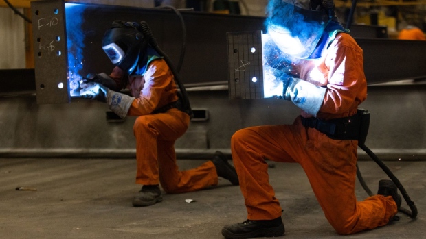 Employees weld sections of fabricated steel beams at Severfield Plc steel fabricators in Dalton, near Thirsk, UK, on Sunday, Aug. 22, 2022. The UK is considering measures to alleviate soaring electricity bills for energy-intensive industries such as steel, ceramics and cement in a bid to protect jobs and boost competitiveness. Photographer: Chris Ratcliffe/Bloomberg