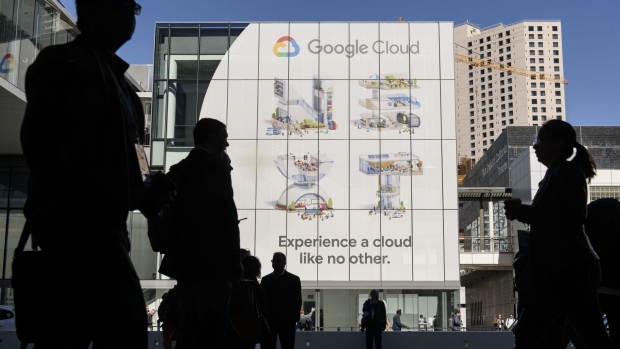 Pedestrians pass in front of a building displaying Google LLC signage during the Google Cloud Next '19 event in San Francisco, California, U.S., on Tuesday, April 9, 2019. The event brings together industry experts to discuss the future of cloud computing. Photographer: Michael Short/Bloomberg