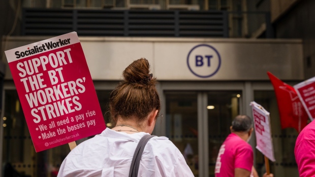 Employees of BT Group Plc, unionized with the Communication Workers Union, stand on a picket line at the BT Tower during a strike in London, UK, on Monday, Aug. 1, 2022. Tens of thousands ofBT's unionized workers voted in favor of the company's first national walkout in more than three decades after the collapse of pay rise negotiations in April.