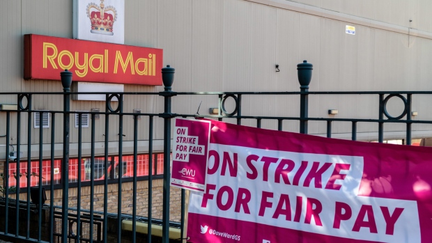 A banner hangs on a picket line outside the Royal Mail Plc Poplar and Isle of Dogs delivery office in London, UK, on Friday, Aug. 26. 2022. The deepening of labor strife at Royal Mail comes as companies across Britain suffer a surge in industrial action as soaring inflation stokes pay claims while labor remains in short supply.