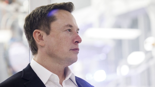 Elon Musk, chief executive officer of Space Exploration Technologies Corp. (SpaceX) and Tesla Inc., listens as Jim Bridenstine, administrator of the U.S. National Aeronautics and Space Administration (NASA), not pictured, speaks during an event at SpaceX headquarters in Hawthorne, California, U.S., on Thursday, Oct. 10, 2019. SpaceX’s Elon Musk and NASA Administrator Jim Bridenstine staged a public show of support for one another at the rocket company’s headquarters Thursday, weeks after the two traded barbs over the closely held company’s delayed efforts to fly astronauts for the first time. Photographer: Patrick T. Fallon/Bloomberg