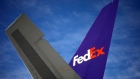 The tail fin of a cargo jet during the morning package sort at the FedEx Express Hub in Memphis, Tennessee, U.S., on Tuesday, March 8, 2022. FedEx Corp. earlier had suspended inbound service to Russia, but now has halted all package movements including domestic deliveries in both Russia and Belarus, according to an employee memo.