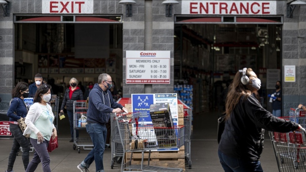 Customers wearing protective masks exit a Costco store in San Francisco, California, U.S., on Wednesday, March 3, 2021. Costco Wholesale Corp. is schedule to release earnings figures on March 4. Photographer: David Paul Morris/Bloomberg