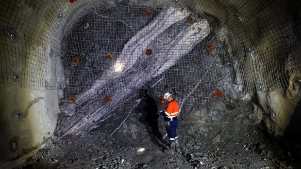 A mine worker stands at the mining face of the underground mine at the Kirkland Lake Gold Ltd. Fosterville Gold Mine in Bendigo, Victoria, Australia, on Friday, Aug. 9, 2019. As prices soar, production in the goldfields of Victoria state is rising again and has already climbed to the highest since 1914 as mining companies dig deeper and new technology helps to uncover once hidden and richer deposits in a region that almost rivaled the Californian gold rush and was thought to have petered out decades ago. Photographer: Carla Gottgens/Bloomberg