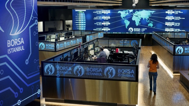 Employees work in their booths at the Borsa Istanbul SA stock exchange in Istanbul, Turkey, on Tuesday, Aug. 14, 2018. While they are growing more critical, the underlying tone of warnings from businesses has so far been supportive of the government in principle, showing there are limits to how much Turkey’s billionaires are feeling emboldened to speak out after elections in June increased President Recep Tayyip Erdogan’s grip on power. Photographer: Ismail Ferdous/Bloomberg