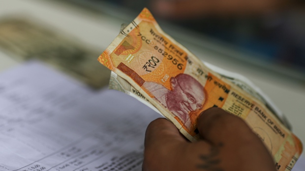Indian rupee banknotes. Photographer: Dhiraj Singh/Bloomberg