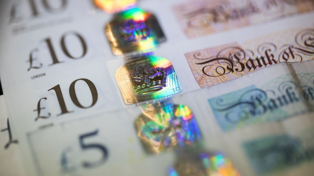 A collection of British five, and ten pound sterling banknotes Photographer: Chris Ratcliffe/Bloomberg