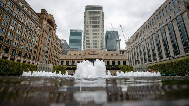 One Canada Square, center, is seen flanked by banking buildings at in the Canary Wharf financial, business and shopping district in London, U.K., on Wednesday, April 21, 2021. As Canary Wharf emerges from the pandemic, the financial hub’s stab at reinvention is accelerating.