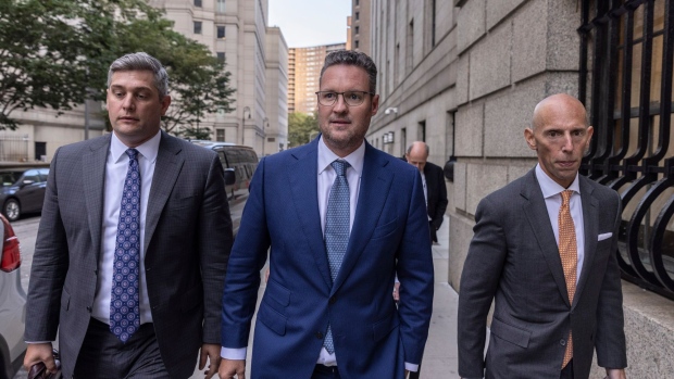 Trevor Milton, founder of Nikola Corp., center, exits court in New York, US, on Monday, Sept. 12, 2022. Milton, who enticed auto-industry leaders and investors with his promise for a revolution in electric trucks, faces a securities-fraud trial beginning this week on allegations that he lied about his company's development of environmentally friendly technology.