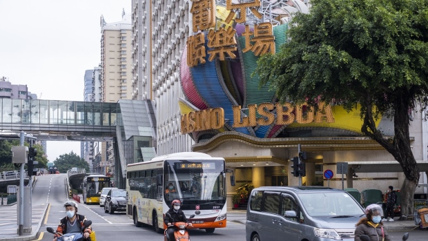 Traffic travel past the Casino Lisboa, operated by SJM Holdings Ltd., in Macau, China, on Wednesday, Feb. 5, 2020. Casinos in Macau, the Chinese territory that's the world's biggest gambling hub, closed for 15 days as China tries to contain the spread of the deadly coronavirus.