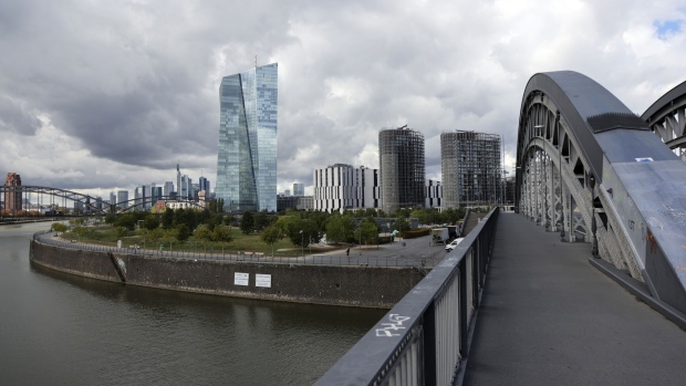 A railway bridge over the River Main near the European Central Bank (ECB) headquarters in Frankfurt, Germany, on Thursday, Sept. 8, 2022. The ECB is on the brink of a jumbo three-quarter-point increase in interest rates to wrest back control over record inflation, even as the risk of a euro-zone recession rises. Photographer: Alex Kraus/Bloomberg