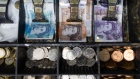 A cash tray holding British pound banknotes and coins in a shop in Barking, UK, on Tuesday, Sept. 13, 2022. As the UK enters a period of public mourning after the death of Queen Elizabeth II, data releases are likely to show a temporary reprieve in inflation and a jump in wage growth.