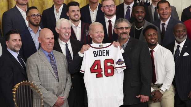 WASHINGTON, DC - SEPTEMBER 26: U.S. President Joe Biden poses with a jersey gifted to him by the Atlanta Braves as he welcomes the 2021 World Series champion team to the White House, September 26, 2022 in Washington, DC. The Braves defeated the Houston Astros in six games. (Photo by Win McNamee/Getty Images)