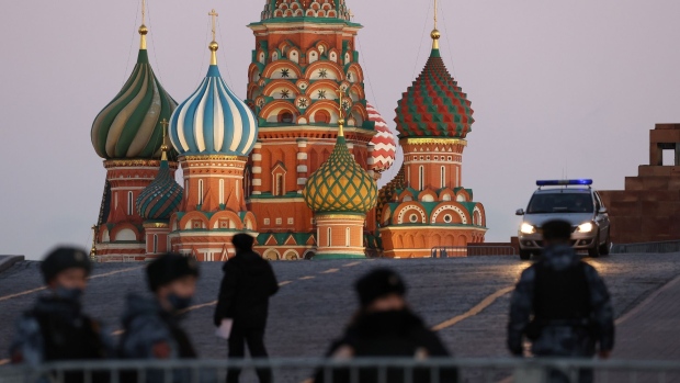 Soldiers from the Russian National Guard patrol the area surrounding Saint Basil's Cathedral on Red square in Moscow, Russia, on Thursday, Feb. 24, 2022. Russian forces attacked targets across Ukraine after President Vladimir Putin ordered an operation to “demilitarize” the country, prompting international condemnation and threats of further punishing sanctions on Moscow, sending markets tumbling worldwide. Photographer: Andrey Rudakov/Bloomberg