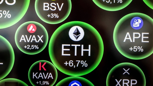 An Ethereum logo, center, on an electronic screen inside a cryptocurrency exchange in Barcelona, Spain, on Thursday, Sept. 8, 2022. The upcoming 'merge' will be the Ethereum blockchain's most ambitious software upgrade ever, with the upgrade representing a fundamental overhaul of how the Ethereum blockchain works. Photographer: Angel Garcia/Bloomberg