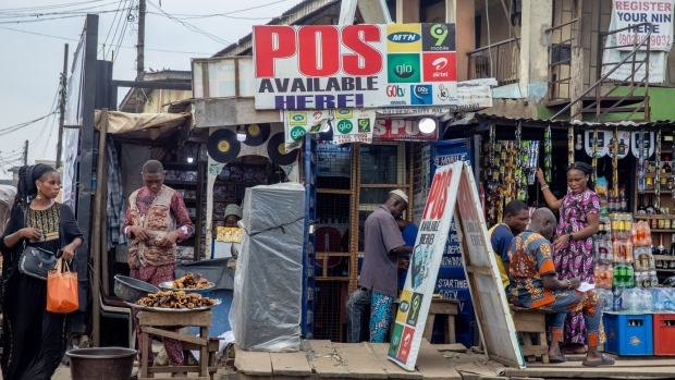 A mobile money services store at the roadside in Lagos, Nigeria, on Saturday, Sept. 24, 2022. Nigeria's inflation rate hit a fresh 17-year high in August, placing renewed pressure on the central bank to increase interest rates. Photographer: Damilola Onafuwa/Bloomberg