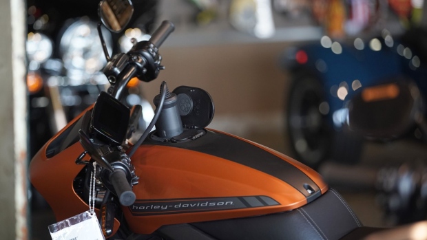 A charger is plugged into a LiveWire electric motorcycle at a Harley-Davidson showroom and repair shop in Lindon, Utah, U.S., on Monday, April 19, 2021. Harley-Davidson Inc. reported better-than-expected first-quarter profit and raised a key sales outlook for the year, bolstering Chief Executive Officer Jochen Zeitz’s plans to revive the struggling motorcycle maker. Photographer: George Frey/Bloomberg