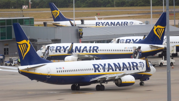 Passenger aircraft, operated by Ryanair Holdings Plc, on the tarmac at London Stansted Airport, operated by Manchester Airport Plc, in Stansted, U.K., on Monday, July 25, 2022. Ryanair said passengers remain cautious about booking, clouding its prospects beyond a summer travel boom in which it’s suffering less disruption than many of its rivals. Photographer: Chris Ratcliffe/Bloomberg