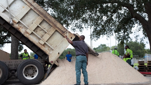 A truck deposits sand for sandbags ahead of Hurricane Ian in St. Petersburg, Florida, US, on Tuesday, Sept. 27, 2022. Ian made landfall over western Cuba as a major Category 3 hurricane, while churning toward Florida in what could be the worst storm to hit Tampa in over a century.
