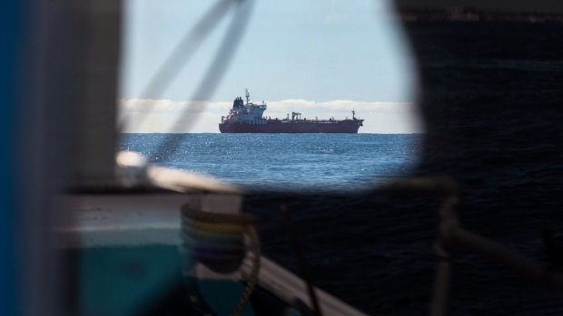 An oil tanker sits at anchor in this view from a fishing boat off the coast of Southwold, U.K., on Friday, May 15, 2020. Nine tankers carrying about 5.58 million barrels of North Sea crude that loaded in April are floating off U.K. ports, according to ship-tracking data compiled by Bloomberg. Photographer: Chris Ratcliffe/Bloomberg