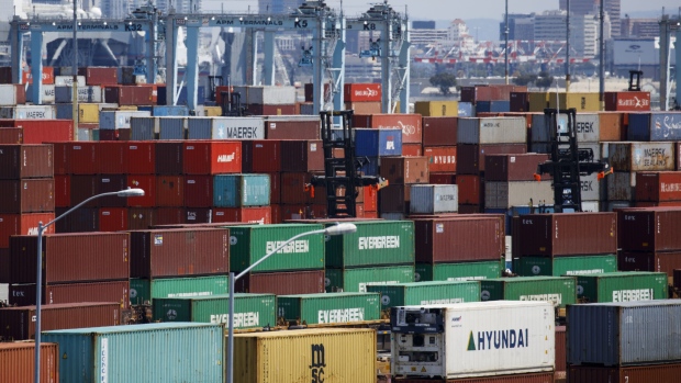 Shipping containers sit stacked in the APM shipping terminal at the Port of Los Angeles in Los Angeles, California, U.S., on Tuesday, May 7, 2019. The terminal is planning to replace diesel trucks and human workers. It has already ordered an electric, automated carrier from Finnish manufacturer Kalmar, part of the Cargotec Corp., that can fulfill the functions of three kinds of manned diesel vehicles: a crane, top-loader and truck. Photographer: Patrick T. Fallon/Bloomberg