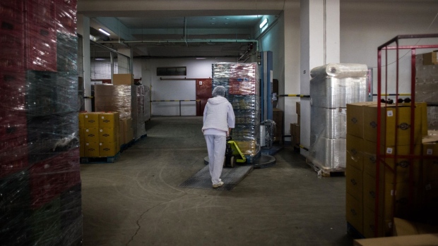 A worker moves crates of bread in a warehouse at the Dobrogea Group flour mill and bread factory in Constanta, Romania, on Wednesday, May 18, 2022. Wheat supplies remain under pressure globally, with unfavorable weather and protectionist measures adding to Ukraine's stymied exports as the country's Black Sea Ports remain blocked..