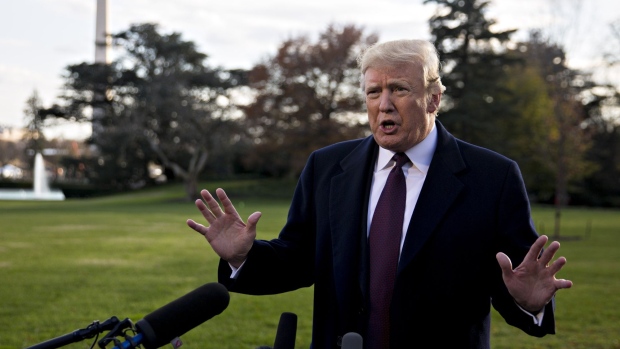 U.S President Donald Trump speaks to members of the media before boarding Marine One on the South Lawn of the White House in Washington, D.C., U.S., on Tuesday, Nov. 20, 2018. Trump said he wouldn't let the murder of U.S-based columnist Jamal Khashoggi jeopardize U.S. relations with Saudi Arabia, citing the potential impact on oil prices and Iranian influence in the Middle East.