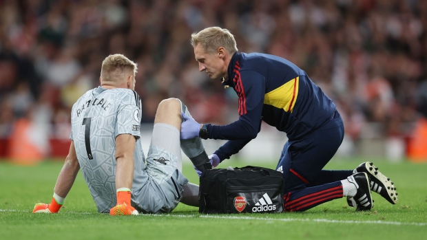 Aaron Ramsdale of Arsenal is treated for an injury during the Premier League match between Arsenal FC and Aston Villa at Emirates Stadium on Aug. 31.