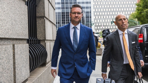 Trevor Milton, founder of Nikola Corp., left, arrives at court in New York, US, on Monday, Sept. 12, 2022. Milton, who enticed auto-industry leaders and investors with his promise for a revolution in electric trucks, faces a securities-fraud trial beginning this week on allegations that he lied about his company's development of environmentally friendly technology.