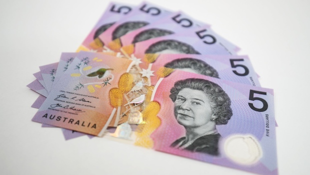 Australian five dollar banknotes are arranged for a photograph in Sydney, Australia, on Friday, Aug. 4, 2017. The Australian dollar rose for the first time in six days after an index showed business confidence improved last month and iron ore prices extended gains.