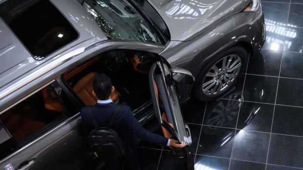 A visitor looks at a Toyota Motor Corp. Lexus LX600 vehicle at the company's showroom in Toyota City, Aichi Prefecture, Japan, on Monday, June 13, 2022. Toyota will hold its annual shareholders' meeting on June 15.