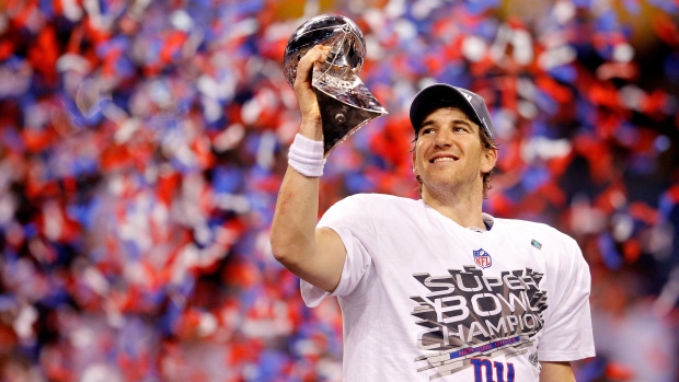Quarterback Eli Manning #10 of the New York Giants poses with the Vince Lombardi Trophy after the Giants defeated the Patriots in Super Bowl XLVI in Indianapolis on Feb. 5, 2012.