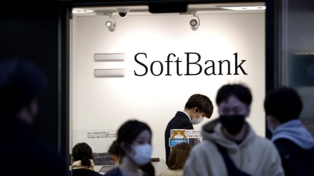 The SoftBank Corp. logo displayed inside a store in Tokyo, Japan, on Sunday, Nov. 7, 2021. SoftBank Group Corp. might see a return to investment losses when it reports earnings on Monday, as the impact of China’s regulatory crackdown begins to hit valuations in its Vision Fund portfolio. Photographer: Kiyoshi Ota/Bloomberg