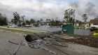 A broken utility pole on a flooded street following Hurricane Ian in Fort Myers, Florida, US, on Thursday, Sept. 29, 2022. Hurricane Ian, one of the strongest hurricanes to hit the US, weakened to a tropical storm but continues to dump rain on the state as it makes its way up the US Southeast.