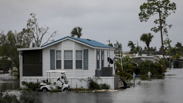 A flooded house following Hurricane Ian in Fort Myers, Florida, US, on Thursday, Sept. 29, 2022. Hurricane Ian, one of the strongest hurricanes to hit the US, weakened to a tropical storm but continues to dump rain on the state as it makes its way up the US Southeast.