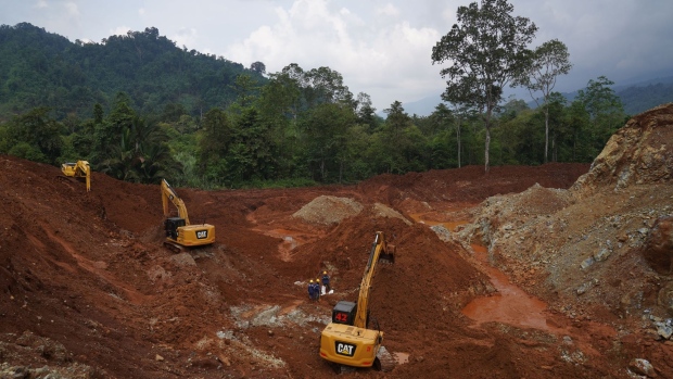 Excavators in a pit at a nickel mine operated by PT Teknik Alum Service in Morowali Regency, Central Sulawesi, Indonesia, on Thursday, March 17, 2022. Indonesia, the world’s top nickel producer, will raise production capacity of the metal after prices soared past $100,000 a ton, while the coal market is unlikely to get similar relief. Photographer: Dimas Ardian/Bloomberg