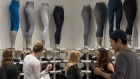 Shoppers look at clothes on display at the Lululemon Athletica Inc. sports apparel store on Regent Street in London, U.K., on Thursday, July 27, 2017. Lululemon is trying to attract more male customers and expand its presence overseas while competitors increase their reliance on discounts.