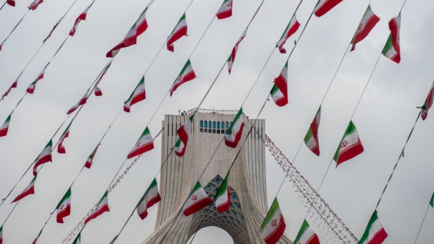 Iranian national flag bunting hangs in front of the Azadi Tower during the celebrations marking 40th anniversary of the Islamic revolution in Tehran, Iran, on Monday, Feb. 11, 2019. As Iran’s Islamic Republic enters a fifth decade, its energy industry has little to celebrate.