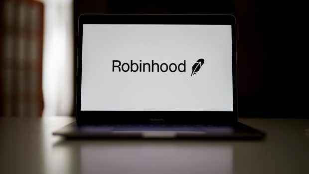 The Robinhood logo on a laptop computer arranged in the Brooklyn borough of New York, U.S., on Saturday, Dec. 19, 2020. Robinhood Markets will pay $65 million to settle allegations that it failed to properly inform clients it sold their stock orders to high-frequency traders and other firms, putting a major compliance headache behind the brokerage even as new ones emerge. Photographer: Gabby Jones/Bloomberg