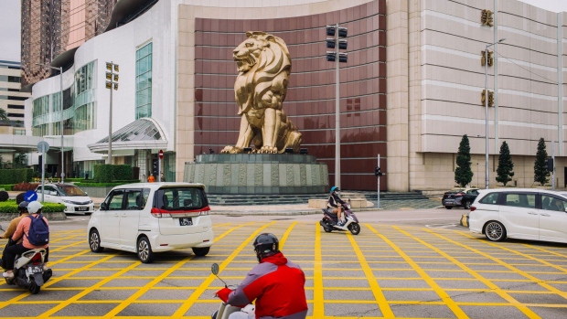Vehicles moves past a lion statue outside the MGM Cotai casino resort, operated by MGM China Holdings Ltd., in Macau, China, on Tuesday, March 3, 2020. Casinos in Macau, the Chinese territory that's the world’s biggest gambling hub, reported a record drop in gaming revenue, as they grappled with the cost of closing down their businesses for 15 days to help contain the deadly coronavirus outbreak. Photographer: Billy H.C. Kwok/Bloomberg