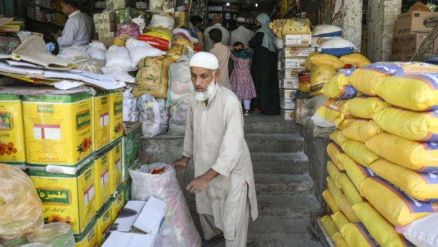 Customers at a grocery store at a market in Islamabad, Pakistan, on Saturday, April 2, 2022. Pakistan Prime Minister Imran Khan said he will face a no-confidence vote on Sunday amid reports that the opposition has garnered the numbers it needs to oust him from office, raising political uncertainty as the country grapples with high inflation and debt repayments.