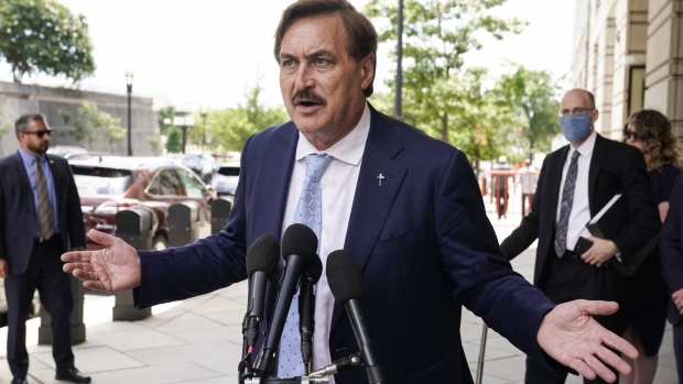 Mike Lindell, chief executive officer of My Pillow Inc., speaks to members of the media while arriving to federal court in Washington, D.C., U.S., on Thursday, June 24, 2021. Lindell and two other high-profile boosters of a debunked but active election conspiracy theory are seeking dismissal of a trio of $1.3 billion defamation suits filed by Dominion Voting Systems Inc.