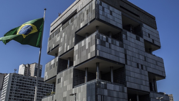 A Brazilian flag flies outside Petroleo Brasileiro SA (Petrobras) headquarters in Rio de Janeiro.