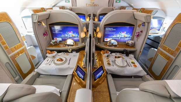 Prepared meals sit on display in the first class cabin of an Airbus SE A380-800 aircraft operated by Emirates Airline, during the first day of the 16th Dubai Air Show at Dubai World Central (DWC) in Dubai, United Arab Emirates, on Sunday, Nov. 17, 2019. The Dubai Air Show is the biggest aerospace event in the Middle East, Asia and Africa and runs Nov. 17 - 21.