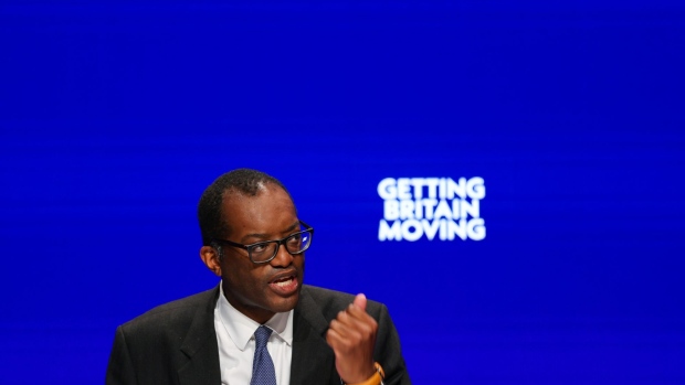 Kwasi Kwarteng, UK chancellor of the exchequer, delivers his keynote speech during the Conservative Party's annual autumn conference in Birmingham, UK, on Monday, Oct. 3, 2022. Liz Truss is standing by Kwarteng after the threat of a rebellion in the ruling party forced them into a humiliating reversal on a plan to cut taxes for the top earners in the UK.