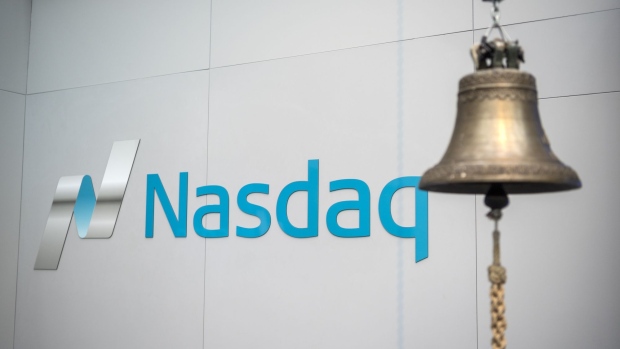 A trading bell hangs in front of Nasdaq signage inside the Nasdaq Swedish Stock Exchange in Stockholm, Sweden, on Thursday, Jan. 31, 2019. Nasdaq Inc. says it can get the backing of a majority of shareholders in Oslo Bors as it prepares to issue a formal takeover offer next week to push aside its rival, Euronext NV.