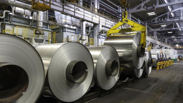 A hoist lowers an aluminium roll onto a storage platform at the Sayanal foil mill, operated by United Co. Rusal, in Sayanogorsk, Russia, on Wednesday, May 26, 2021. United Co. Rusal International PJSC’s parent said the company has produced aluminum with the lowest carbon footprint as the race for cleaner sources of the metal intensifies. Photographer: Andrey Rudakov/Bloomberg