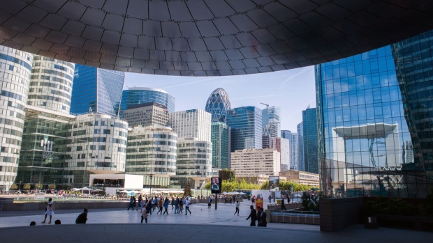Office workers and visitors in La Defense financial district of Paris, France, on Wednesday, Aug. 24, 2022. The French government has set aside tens of billions of euros to shield businesses and households as the cost of French power jumped to a fresh record.